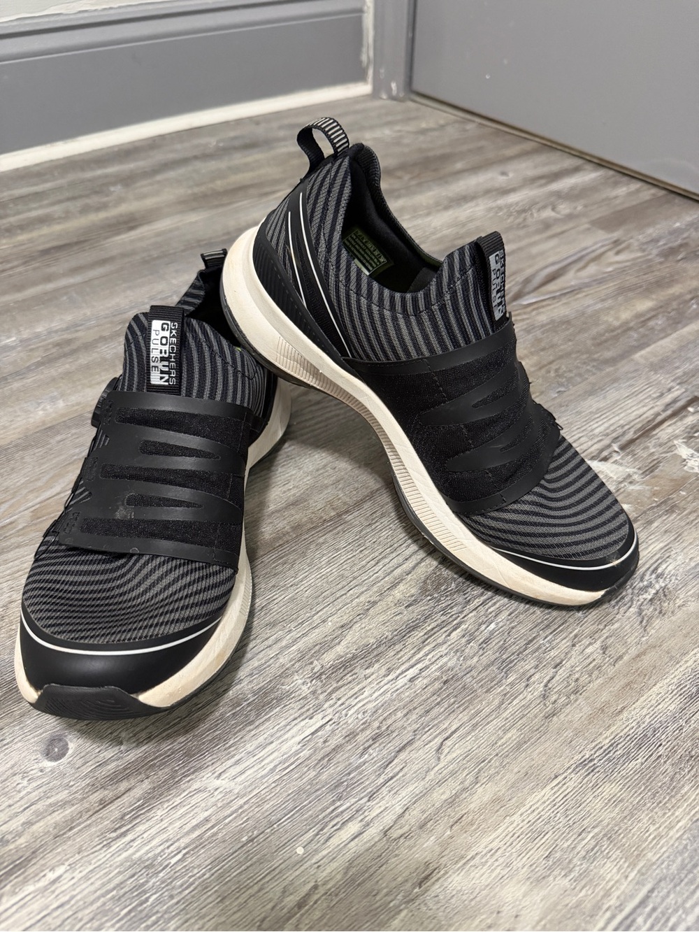 Skechers Black and White Slip-On Knit Sneakers